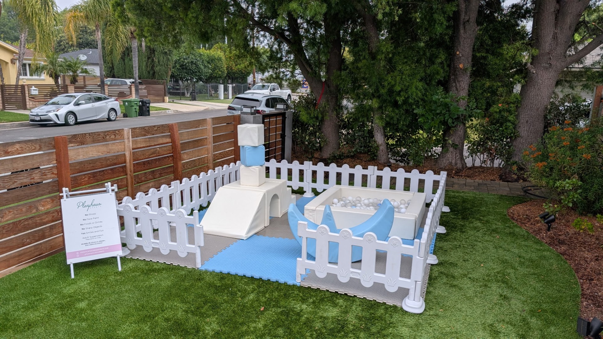 Pastel soft play set with foam climbers and ball pit in a Ventura County backyard