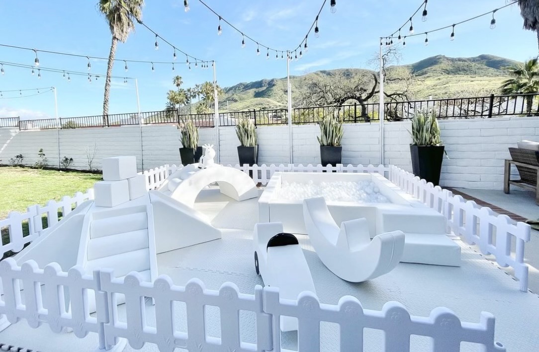 Pastel first birthday party setup with soft play in Los Angeles